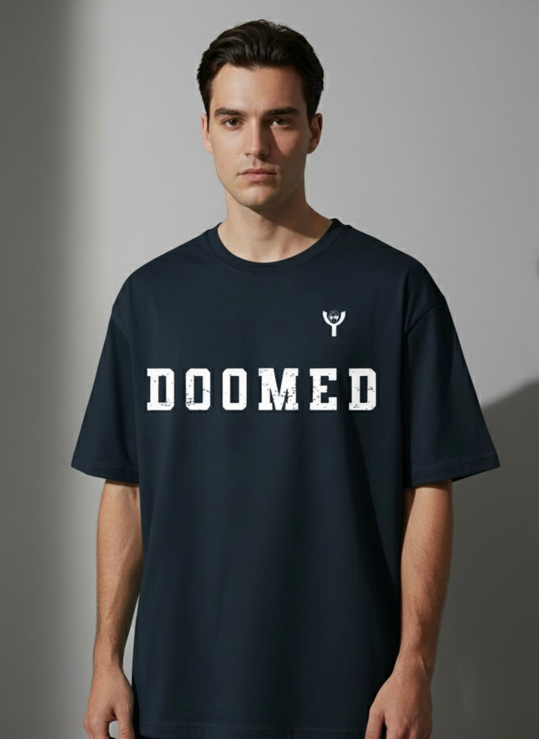Man wearing a Navy Blue t-shirt with 'DOOMED' text on a gray background