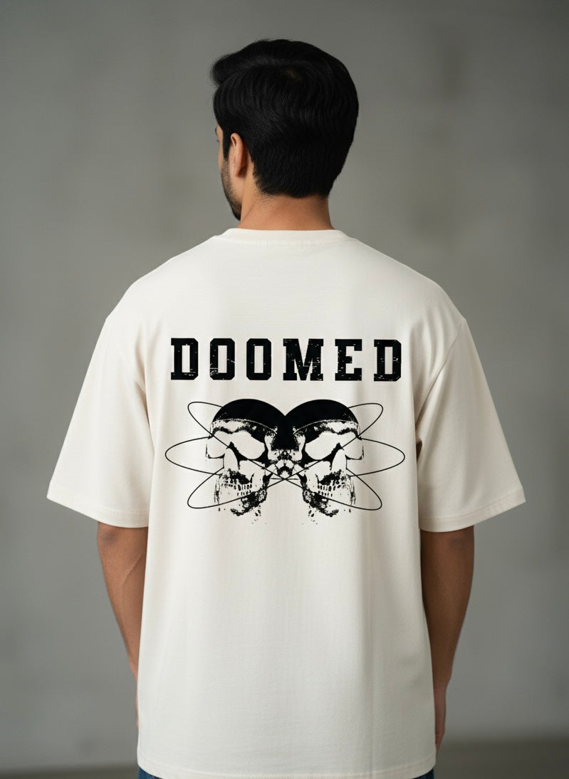 Person wearing a Off White t-shirt with 'DOOMED' text and skull design on the back against a gray background